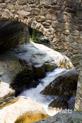 Flowing waters from the waterfall on the west fork of the Pigeon River through High Arch Bridge, NC